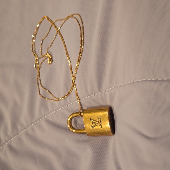 Louis Vuitton Jewelry - LV lock no key on 32" sterling silver goldtone plated chain lock #308